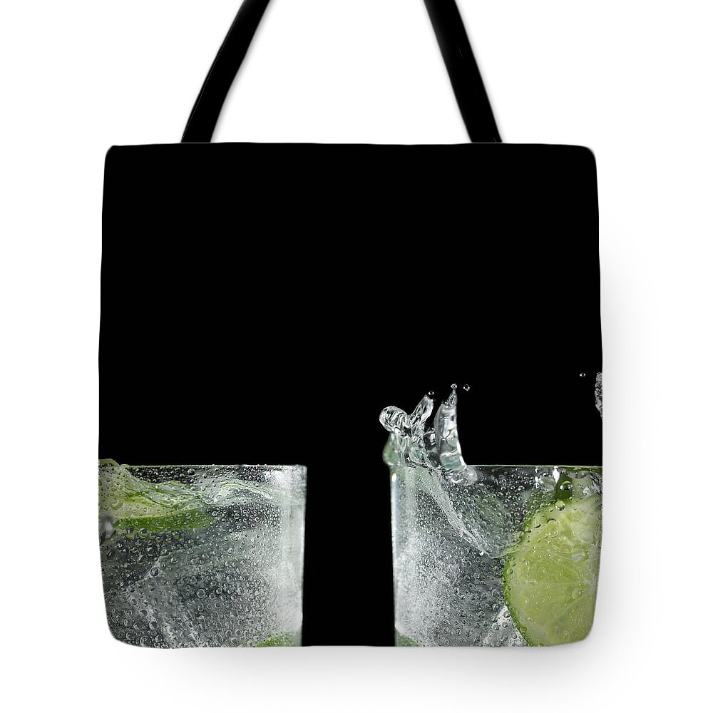 Alcohol Tote Bag featuring the photograph Close-up Of Splashed Cocktails by Monica Rodriguez