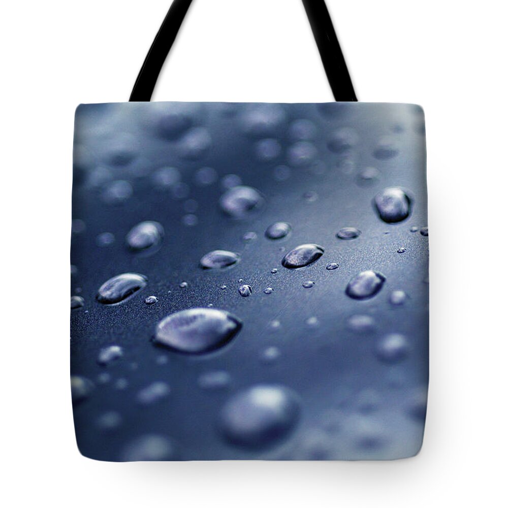 Natural Pattern Tote Bag featuring the photograph Close-up Of Water Droplets On A Surface by Medioimages/photodisc