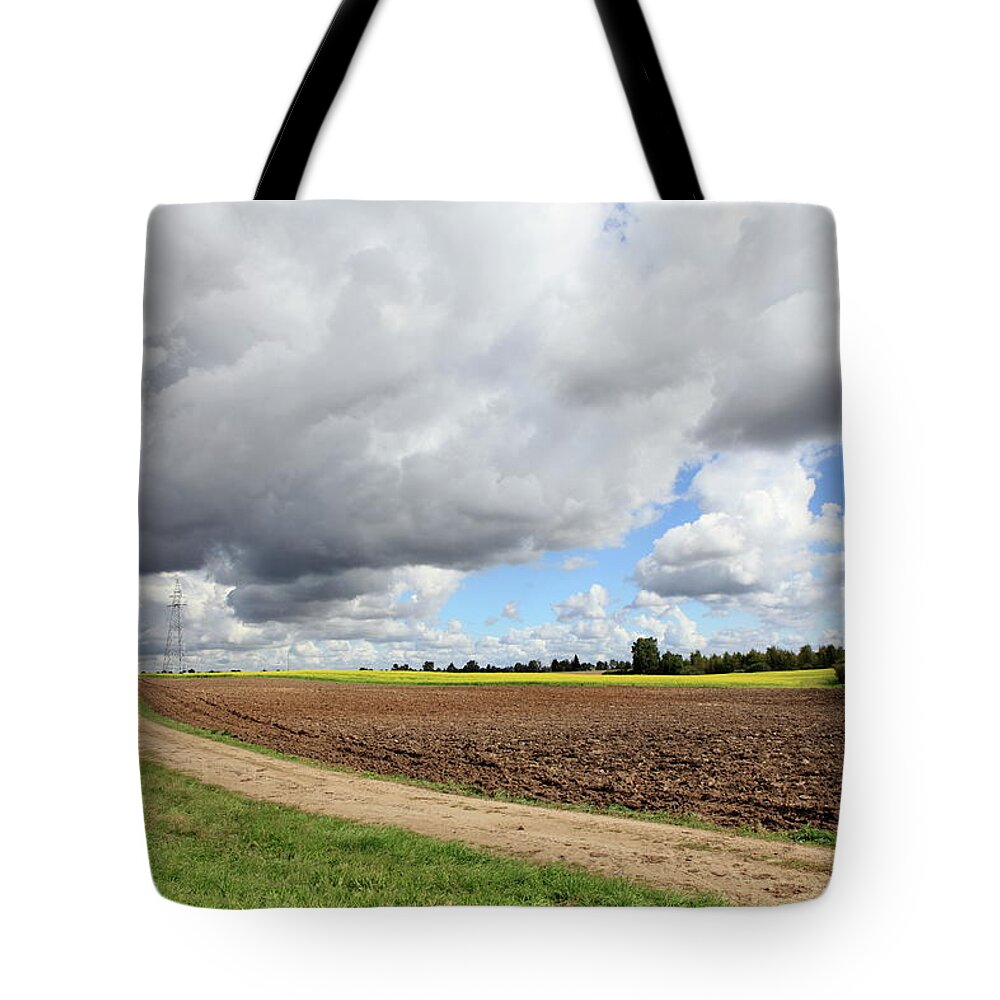 Scenics Tote Bag featuring the photograph Cloudy Agricultural Landscape by Dariuszpa