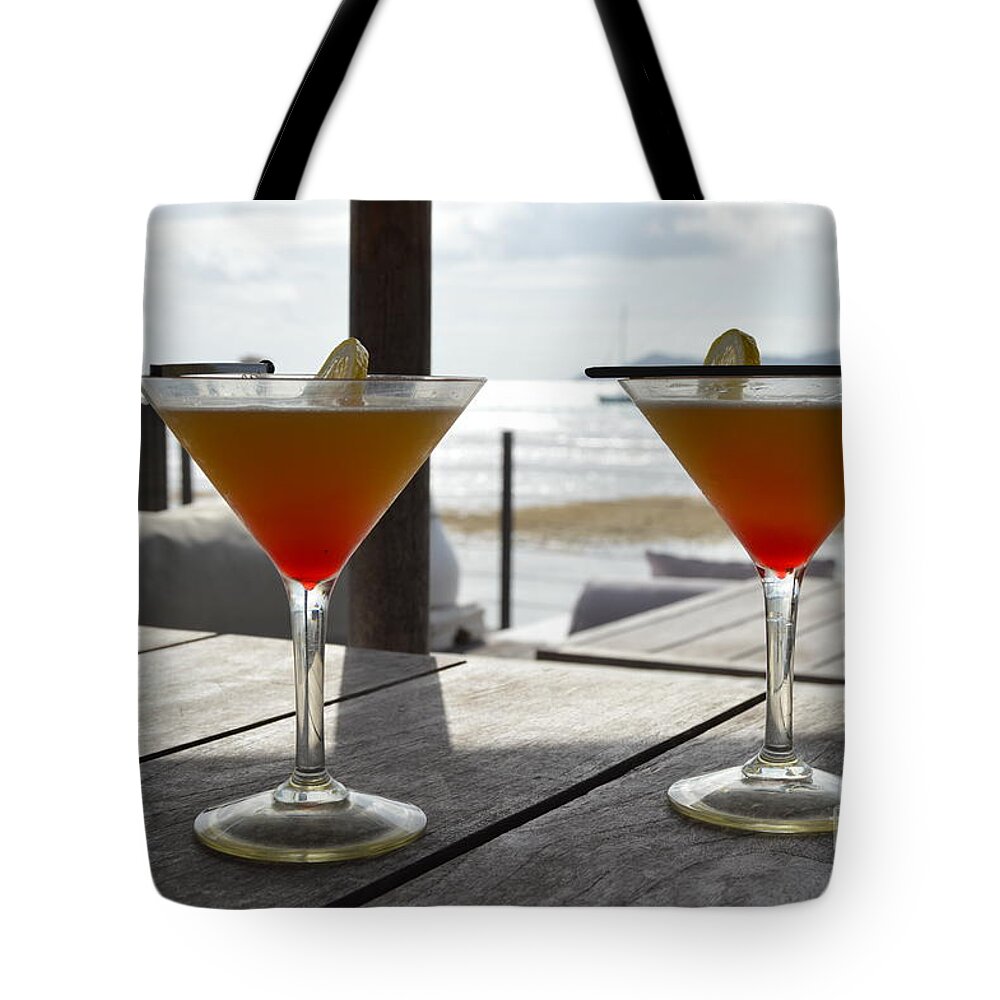 Cocktail Tote Bag featuring the photograph Cocktails by Thomas Schroeder