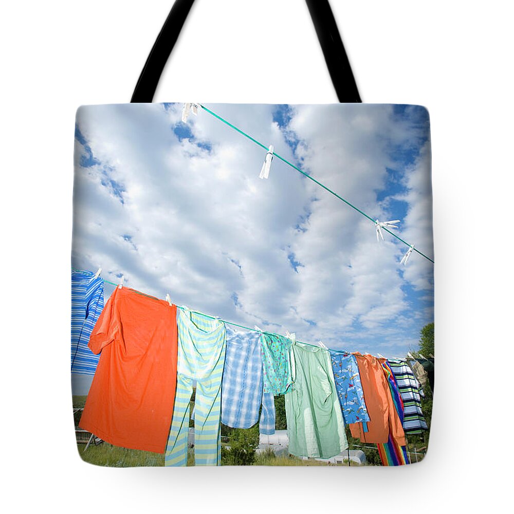 Hanging Tote Bag featuring the photograph Colorful Clothes Line by Zia Soleil