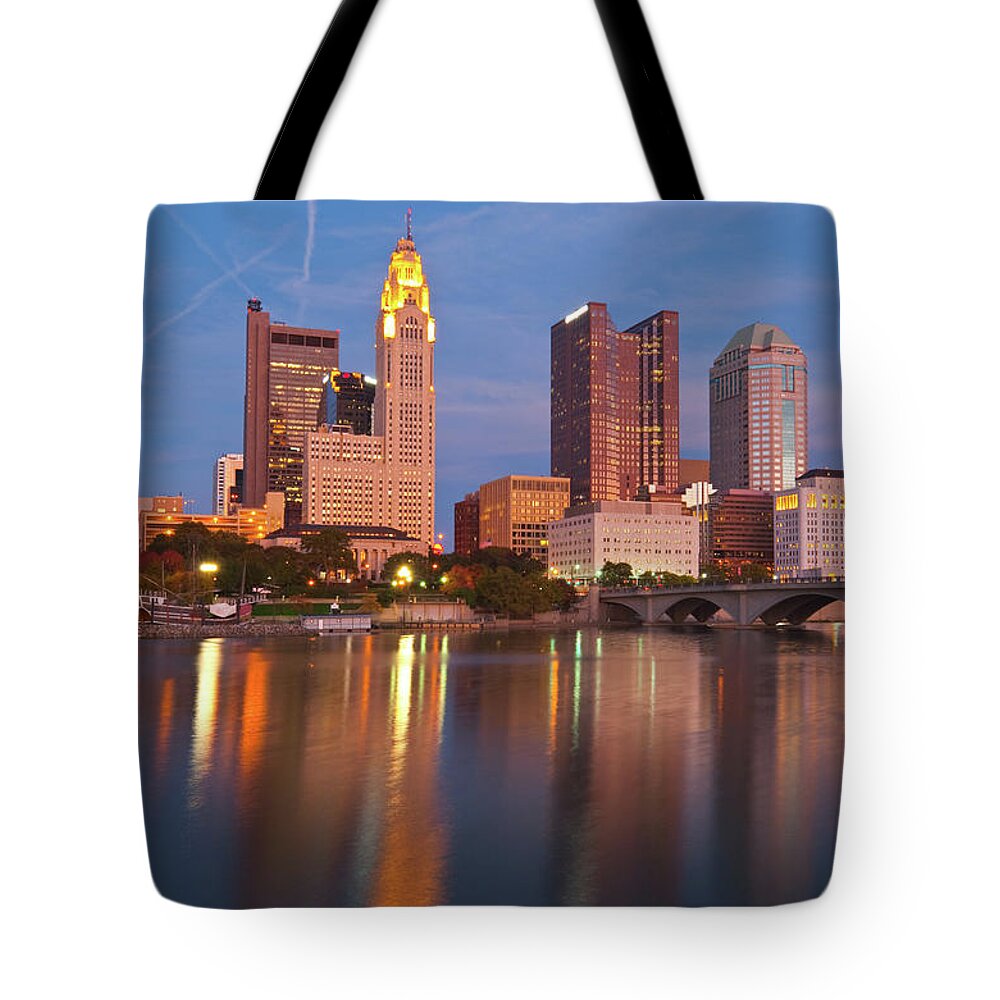 Downtown District Tote Bag featuring the photograph Columbus Waterfront Skyline At Dusk by Davel5957