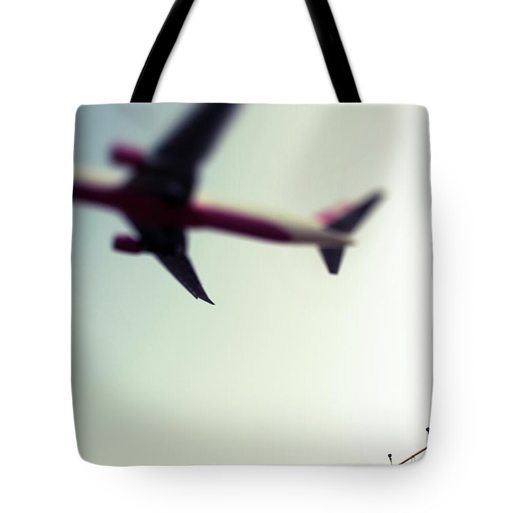 Mid-air Tote Bag featuring the photograph Commercial Jet by Greg Bajor