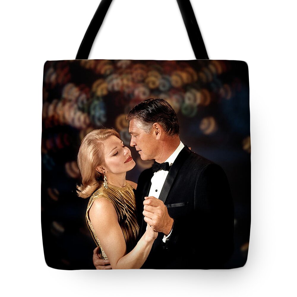 Young Men Tote Bag featuring the photograph Couple Man Woman Arm In Arm Dance by H. Armstrong Roberts