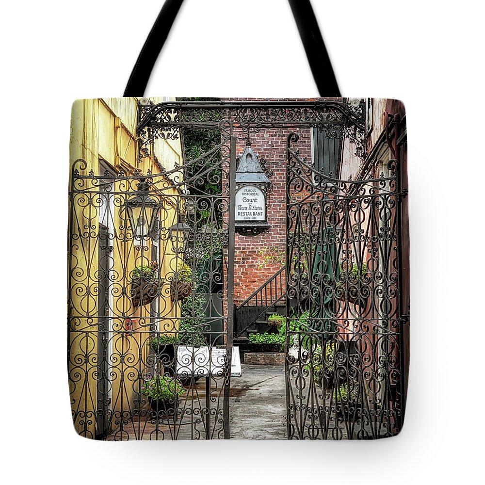Architecture Tote Bag featuring the photograph Court of the Two Sisters Courtyard Gate by Susan Rissi Tregoning