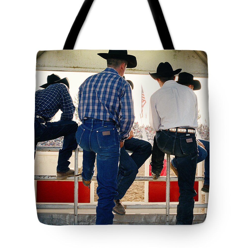 Plaid Shirt Tote Bag featuring the photograph Cowboys Watching Rodeo Arena, Rear View by Reza Estakhrian