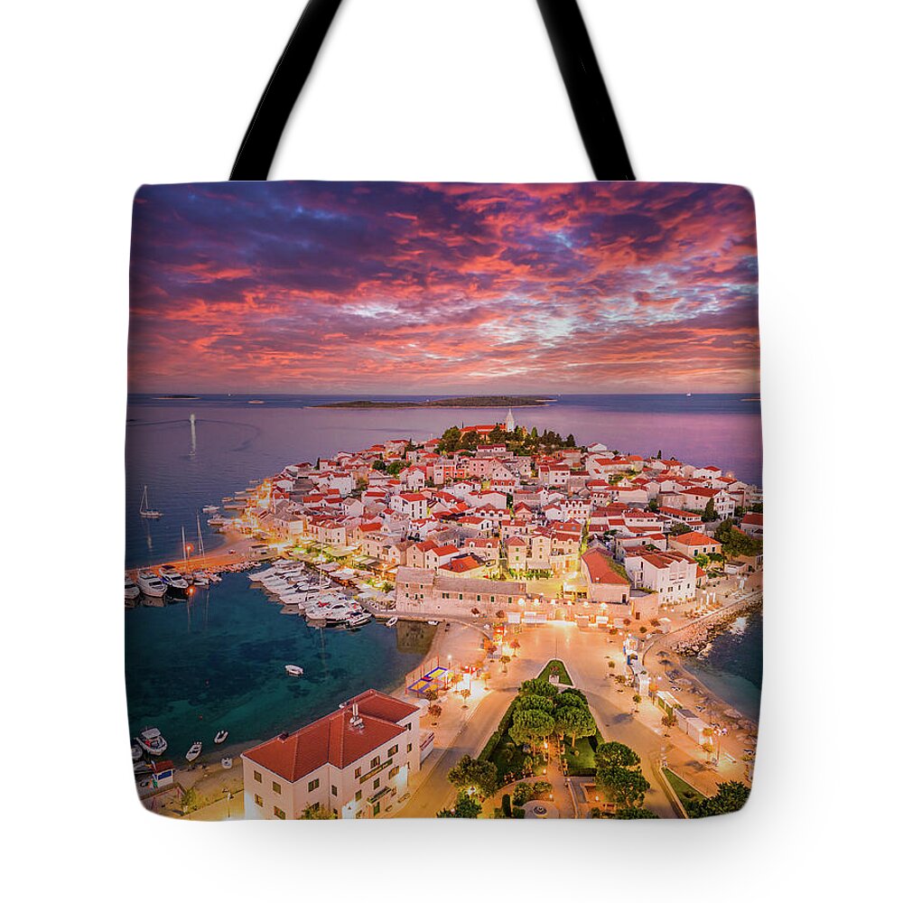 Estock Tote Bag featuring the digital art Croatia, Dalmatia, Primosten, Mediterranean Sea, Adriatic Coast, Aerial View Of Peninsula On Which The Old Town Of Primosten Stands, Blue Hour Before Sunrise With Colored Clouds by Manfred Bortoli