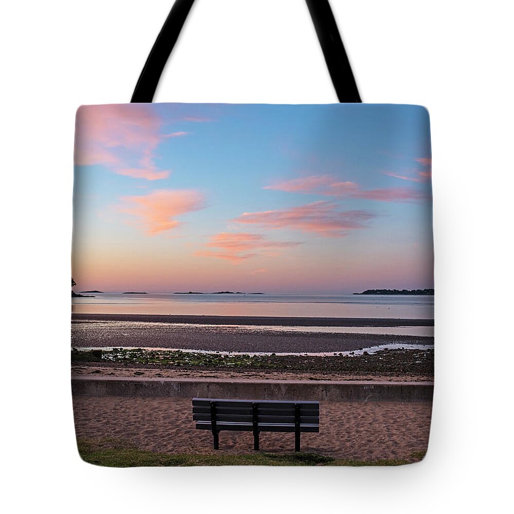 Beverly Tote Bag featuring the photograph Dane Street Beach in Beverly MA Morning Light Red Clouds Bench by Toby McGuire