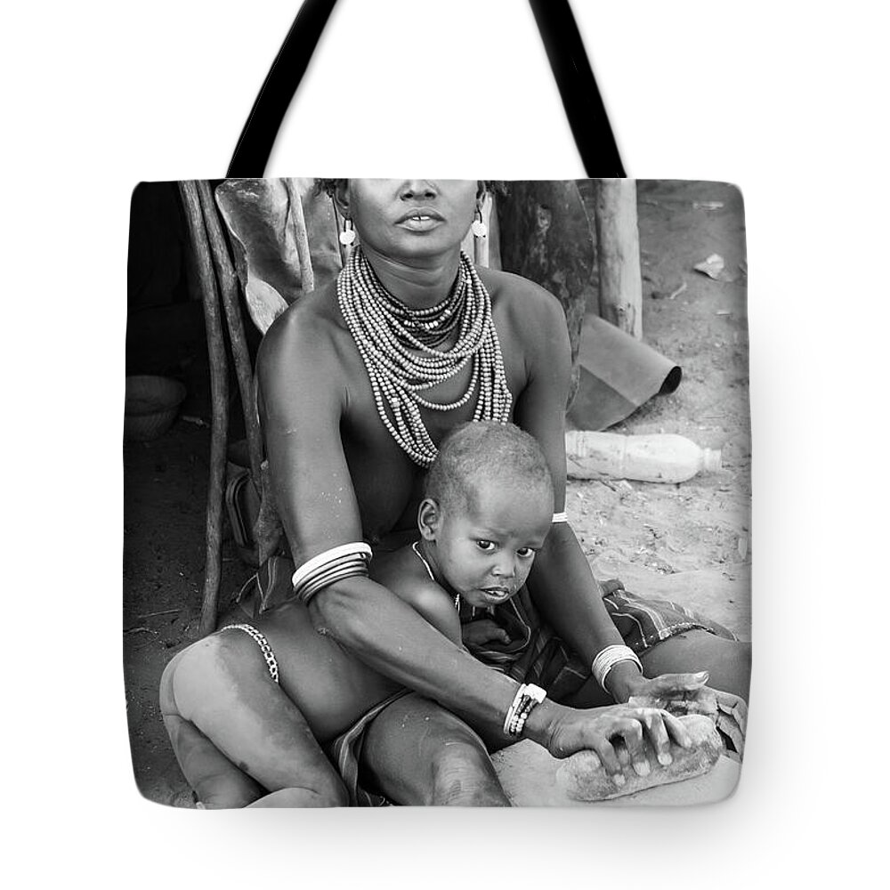 Portrait Tote Bag featuring the photograph Dassanech mother and child by Mache Del Campo