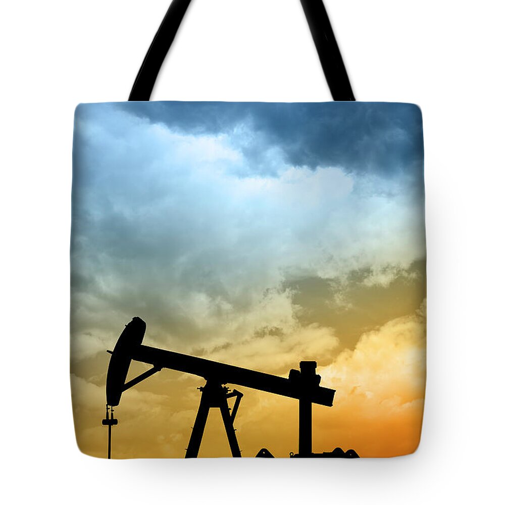 Shadow Tote Bag featuring the photograph Dawn Over Petroleum Pump In The Desert by Grafissimo