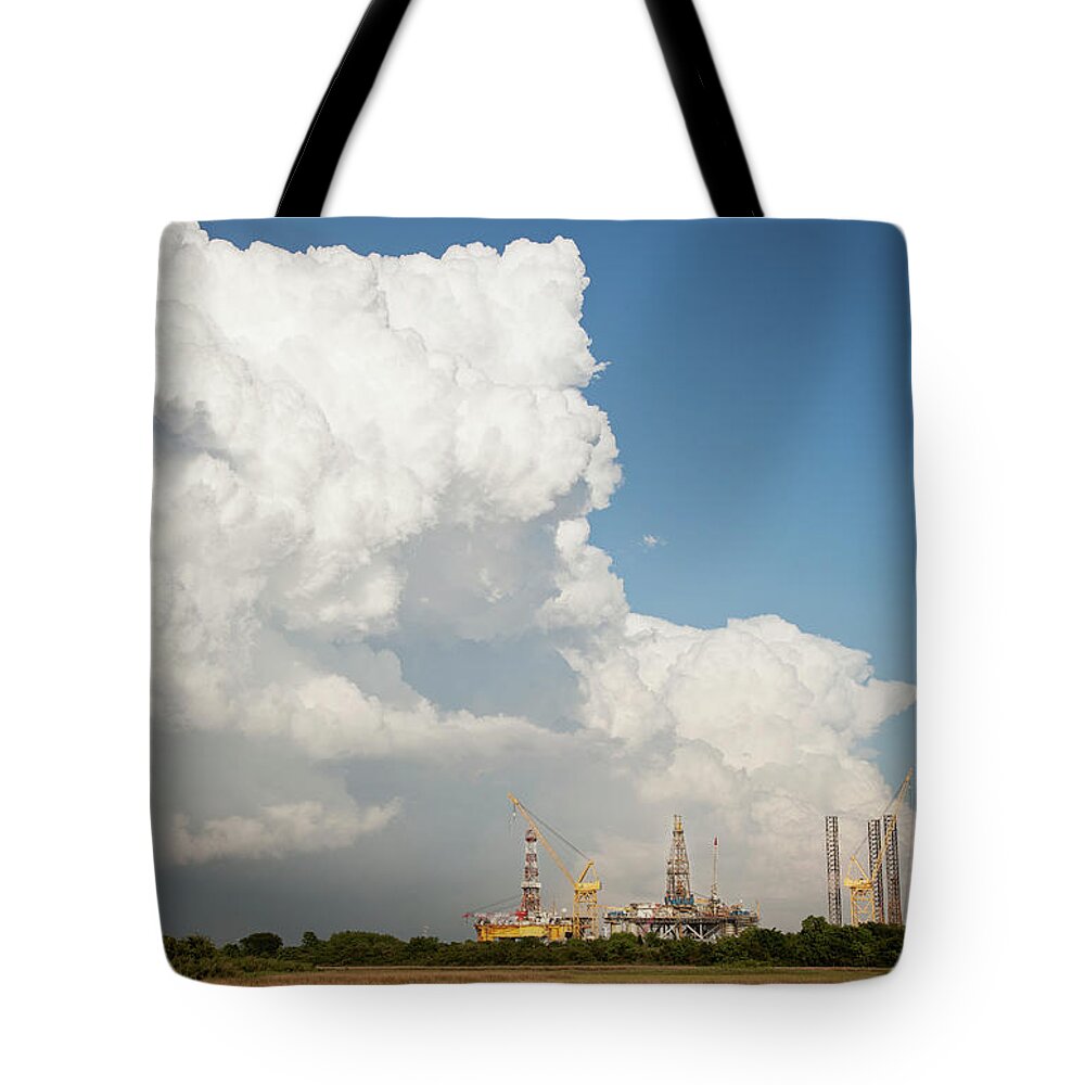 Outdoors Tote Bag featuring the photograph Deep-water Oil Rig Being Repaired On by Ron Levine