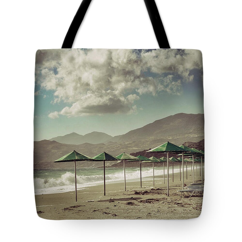 Tranquility Tote Bag featuring the photograph Deserted Sandy Beach With Sunbeds And by Jeren (france)