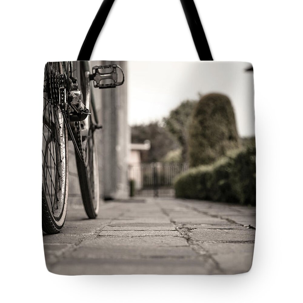 Tranquility Tote Bag featuring the photograph Detail Of Bicycle Wheels by Paolomartinezphotography
