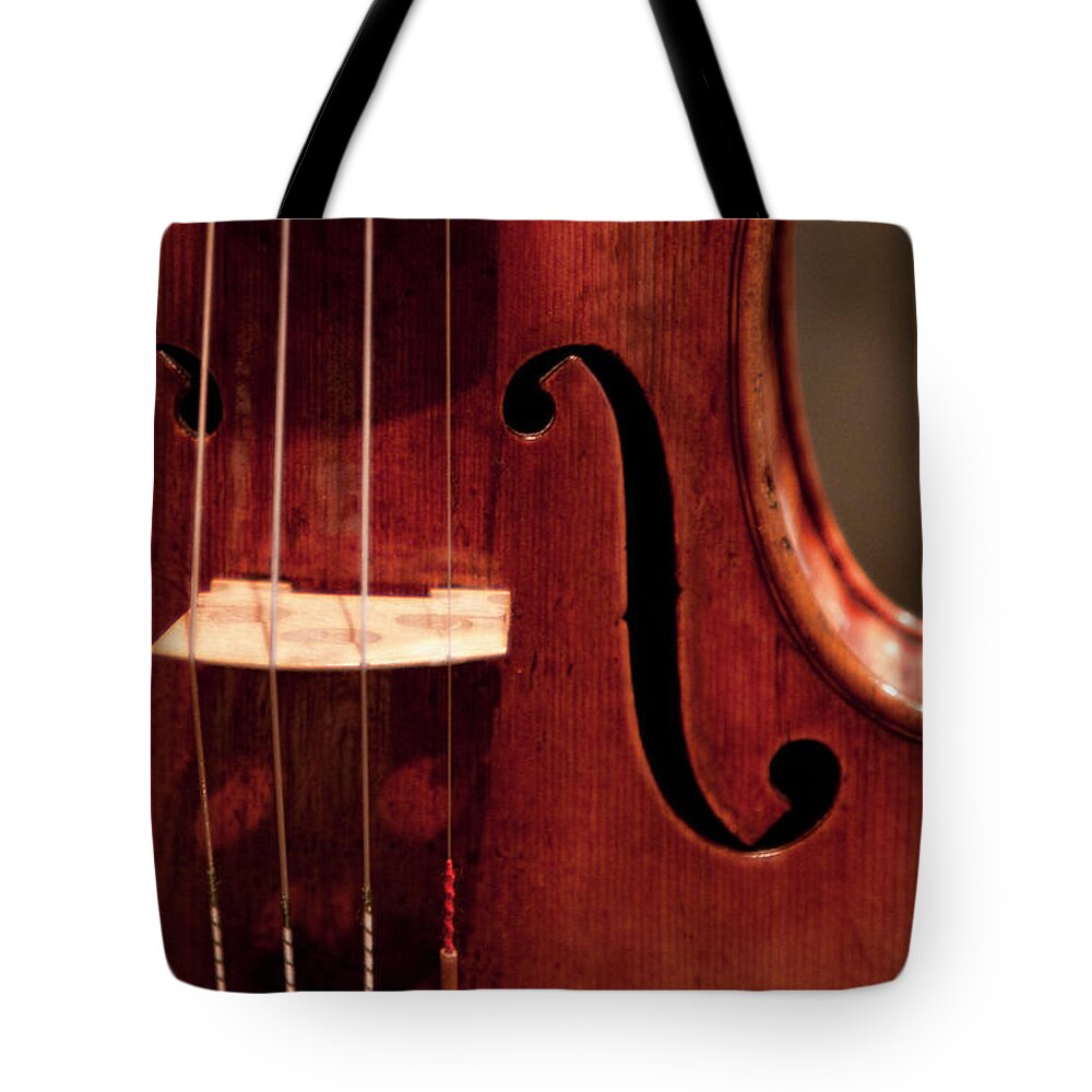 Music Tote Bag featuring the photograph Detail Of Violin by Grant Faint