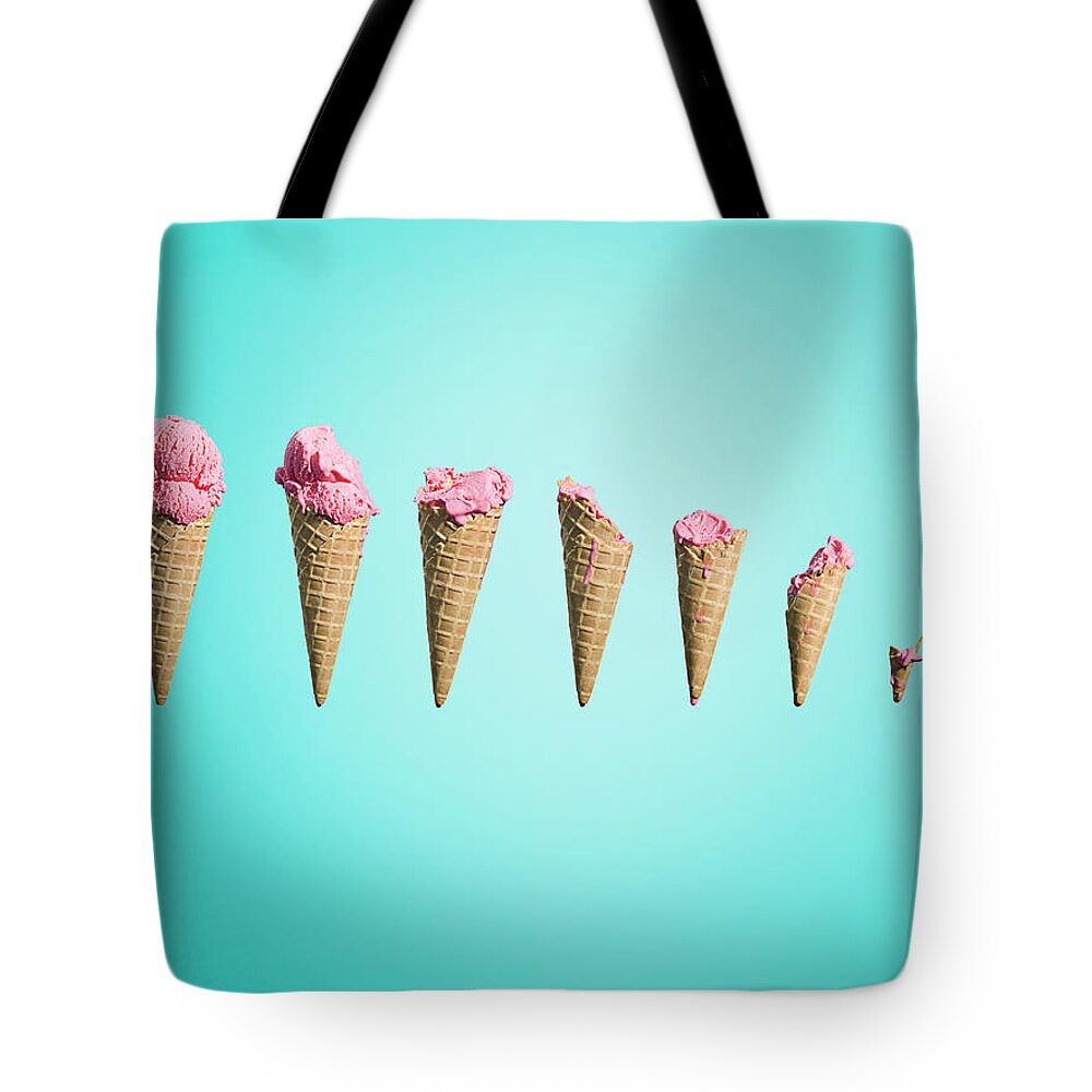 In A Row Tote Bag featuring the photograph Different Stages Of Eaten Ice Creams by Jonathan Knowles