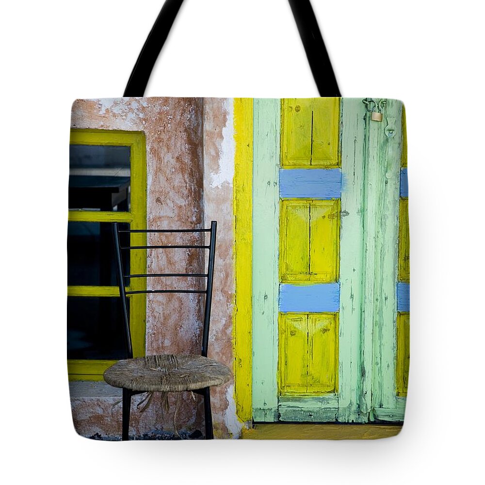 Empty Tote Bag featuring the photograph Door Painted Yellow Blue And Green With by Rubberball/nicole Hill