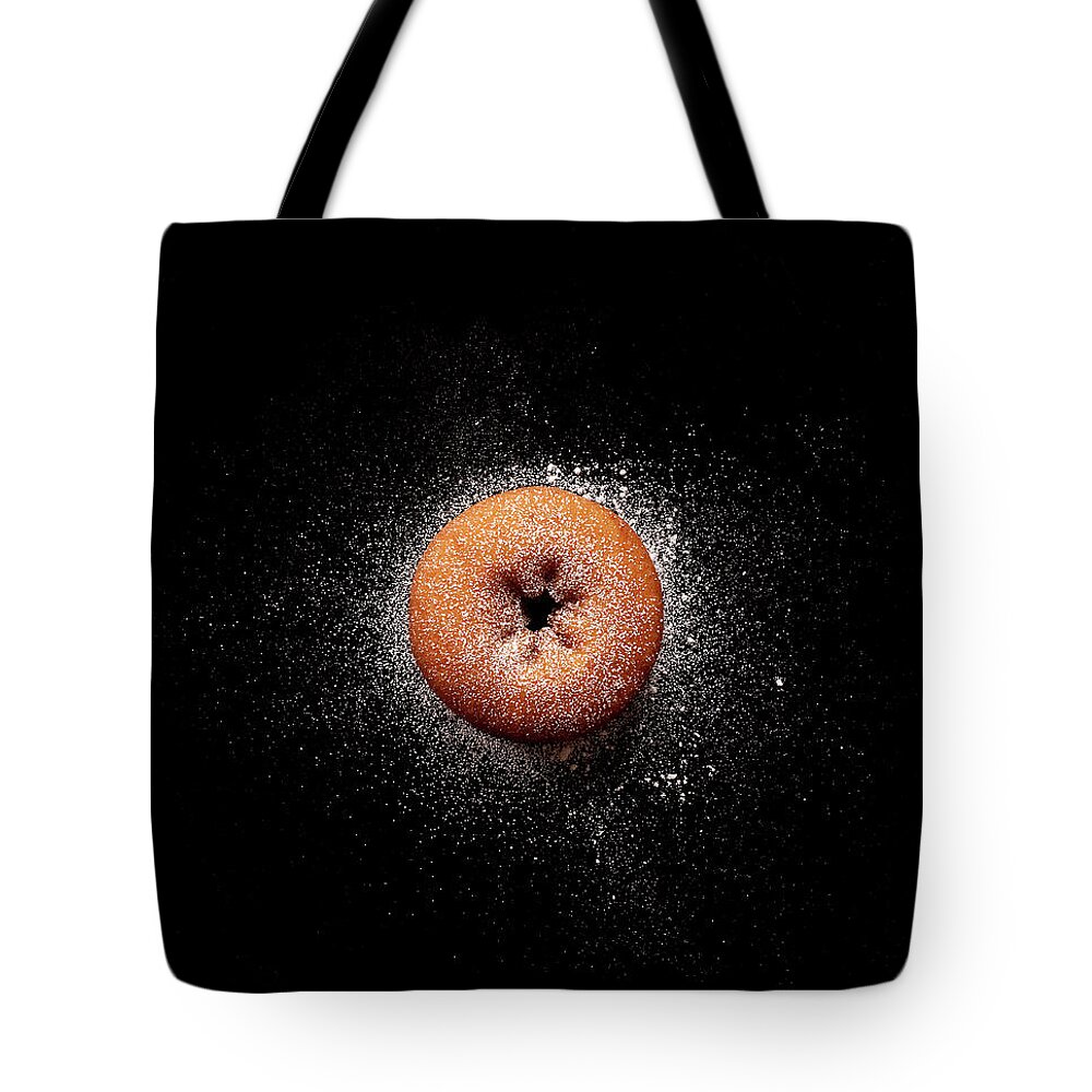 Black Background Tote Bag featuring the photograph Doughnut With Powdered Sugar by Michael Maes