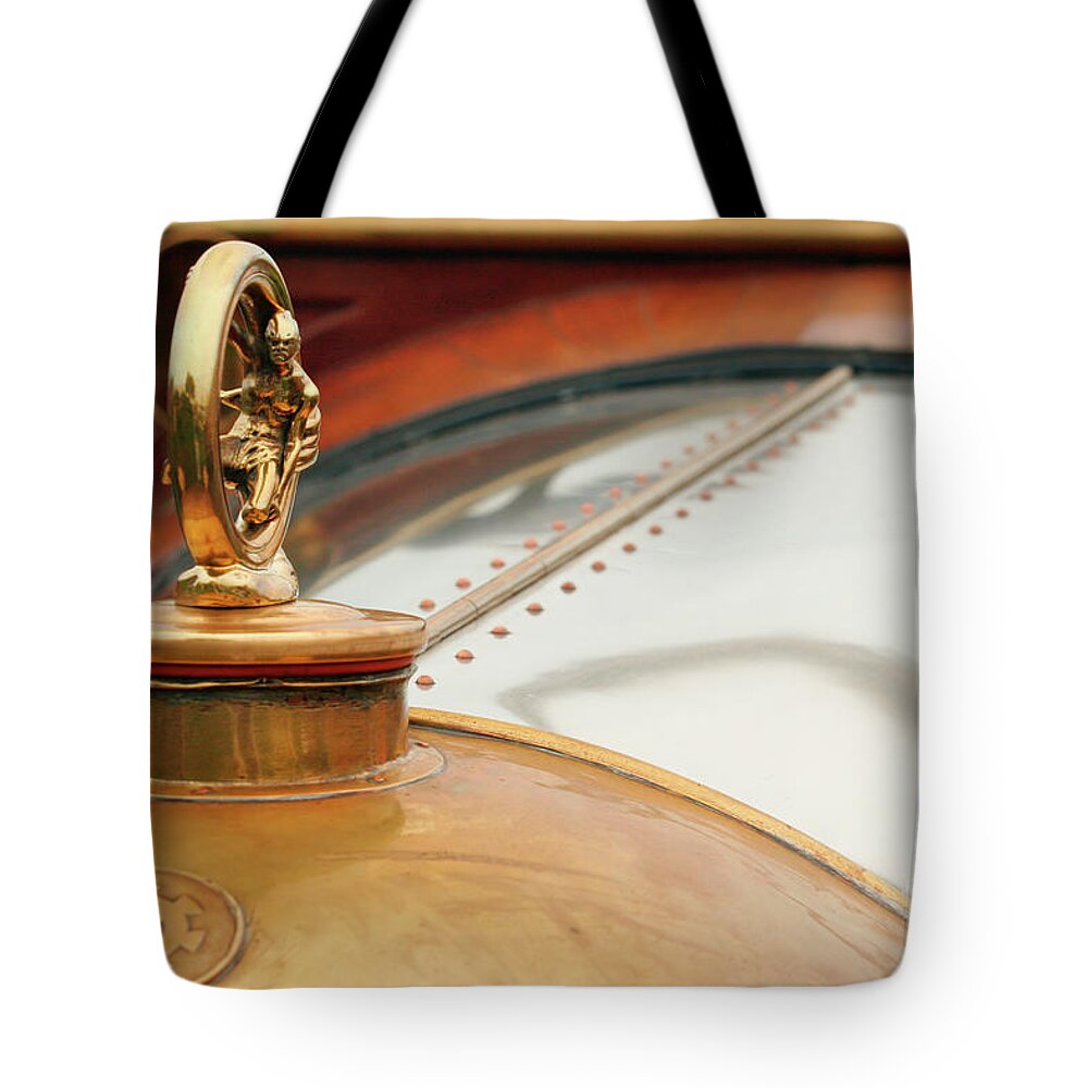 Vintage Tote Bag featuring the photograph Early Brass Hood Ornament by Lucie Collins