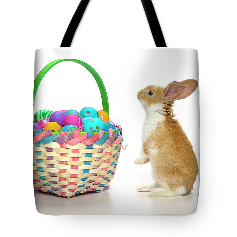 Pets Tote Bag featuring the photograph Easter Bunny And Basket Of Coloured Eggs by Don Farrall