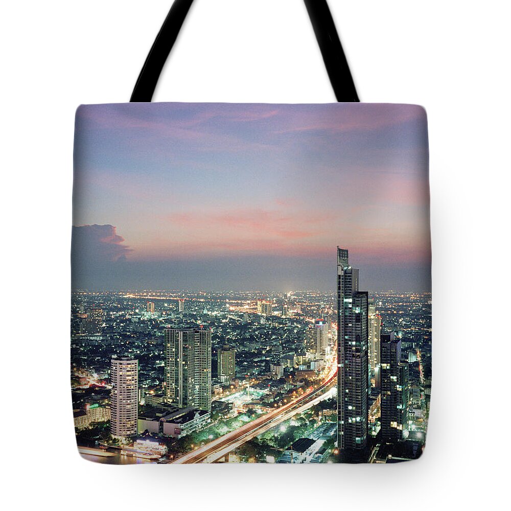 Majestic Tote Bag featuring the photograph Elevated View Of Bangkok Skyline At Dusk by Gary Yeowell