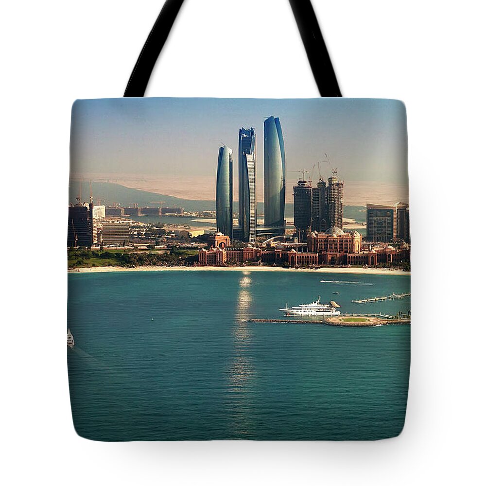 Clear Sky Tote Bag featuring the photograph Etihad Towers And Emirates Palace by Figurative Speech