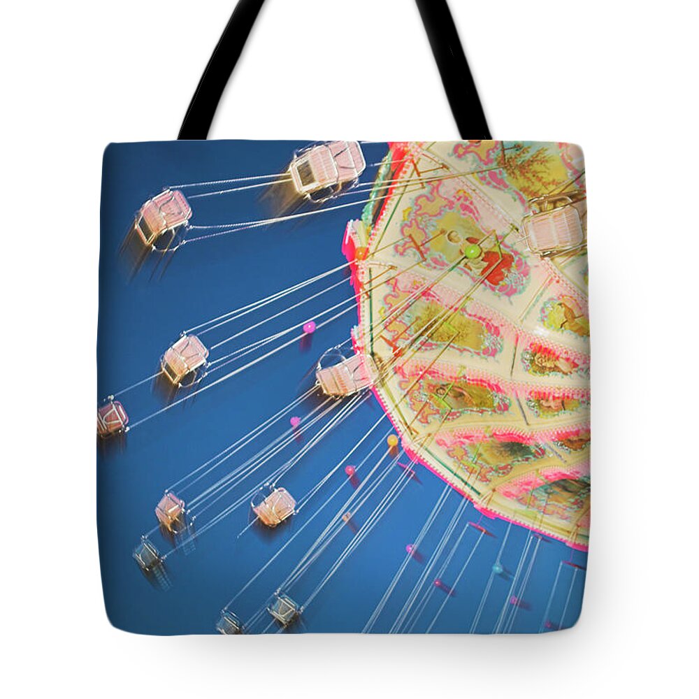 Carousel Tote Bag featuring the photograph Fairground Carousel In Motion At Night by Renaud Visage