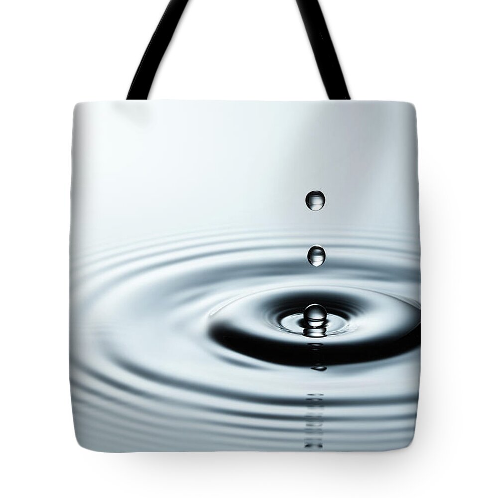 Waving Tote Bag featuring the photograph Falling Water Drops Iv - Freeze Frame by Thomasvogel