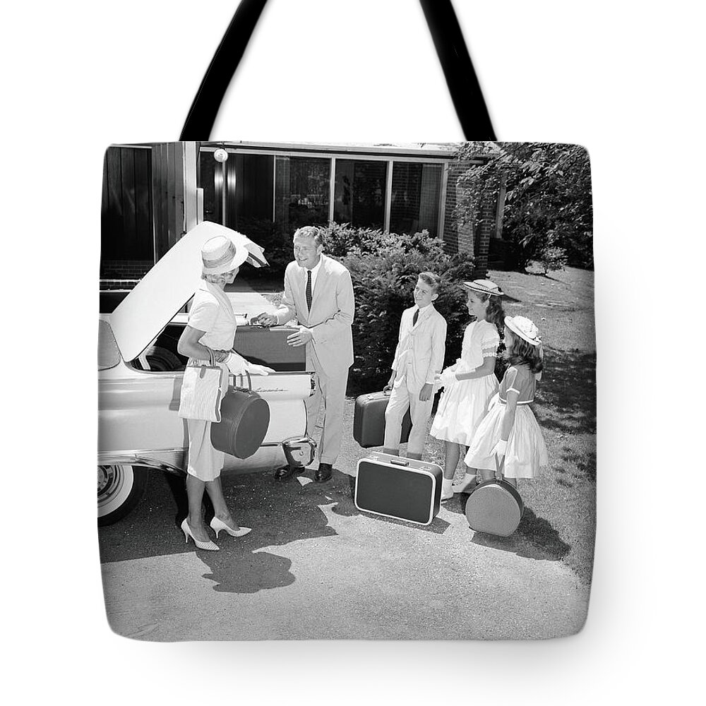 Mid Adult Women Tote Bag featuring the photograph Family Packing Suitcases In Trunk Of by H. Armstrong Roberts