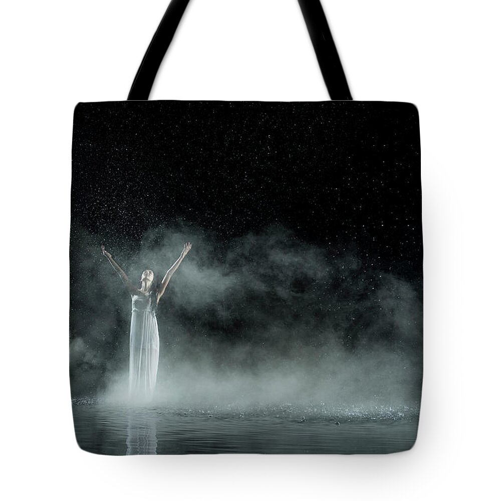 People Tote Bag featuring the photograph Female In White In Water, Rainy Night by Jonathan Knowles