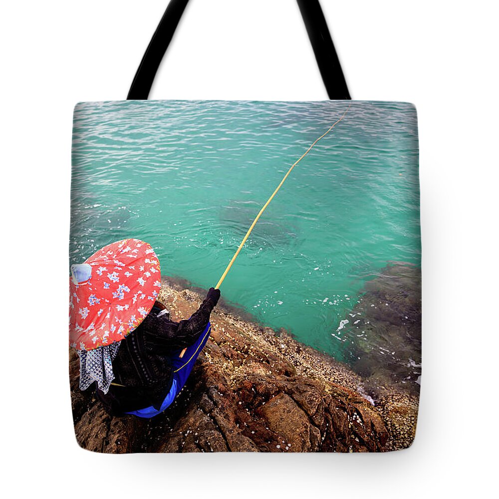 Scenics Tote Bag featuring the photograph Fishing At Rocky Beach by Fredfroese
