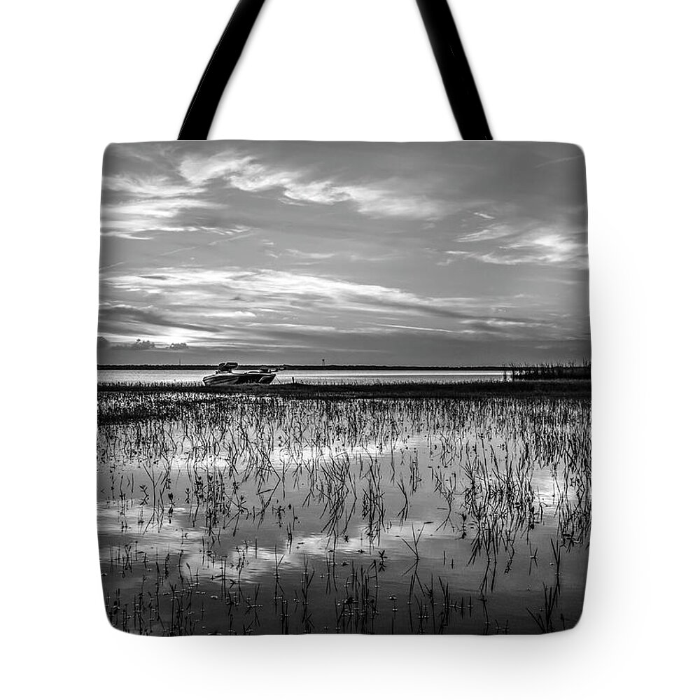 Boats Tote Bag featuring the photograph Fishing Boat at the Lake in Black and White by Debra and Dave Vanderlaan