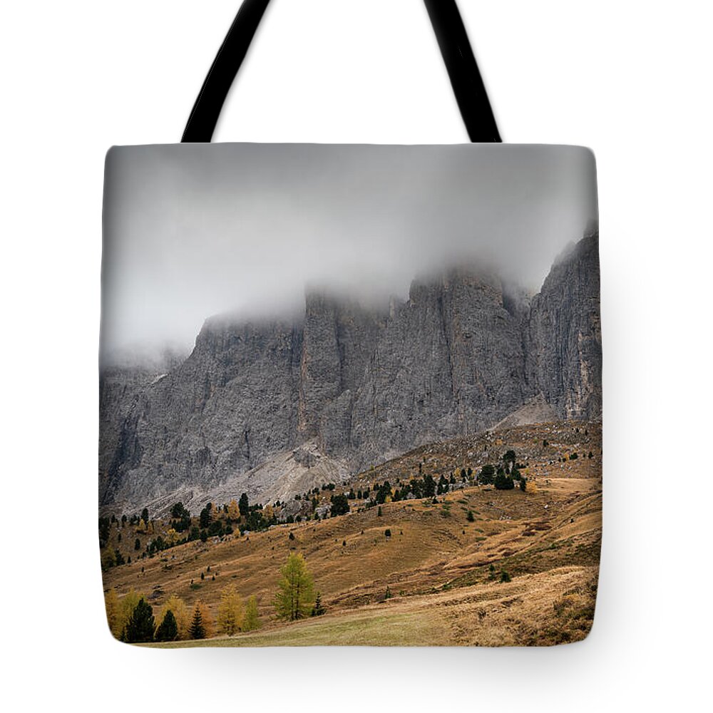 Mood Tote Bag featuring the photograph Foggy mountain landscape of the picturesque Dolomites mountains by Michalakis Ppalis