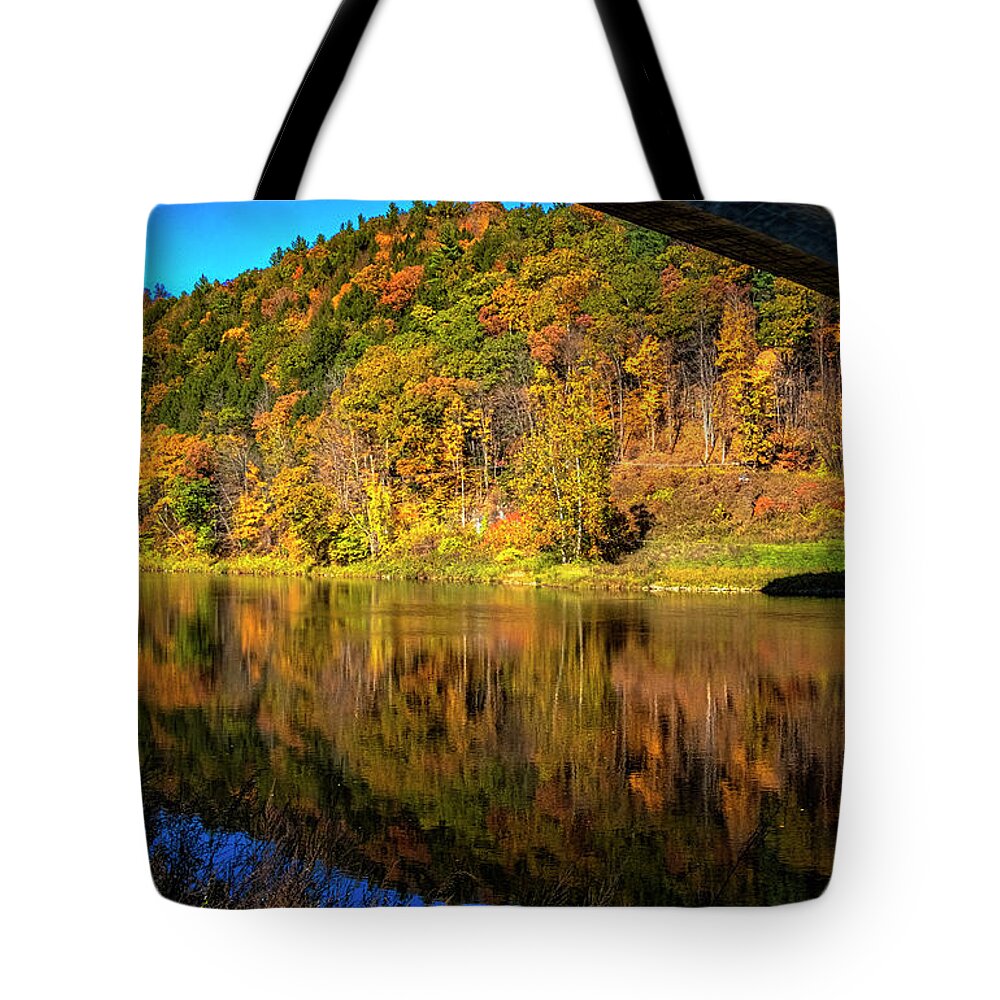 Hayward Garden Putney Vermont Tote Bag featuring the photograph Foliage Under The Bridge by Tom Singleton