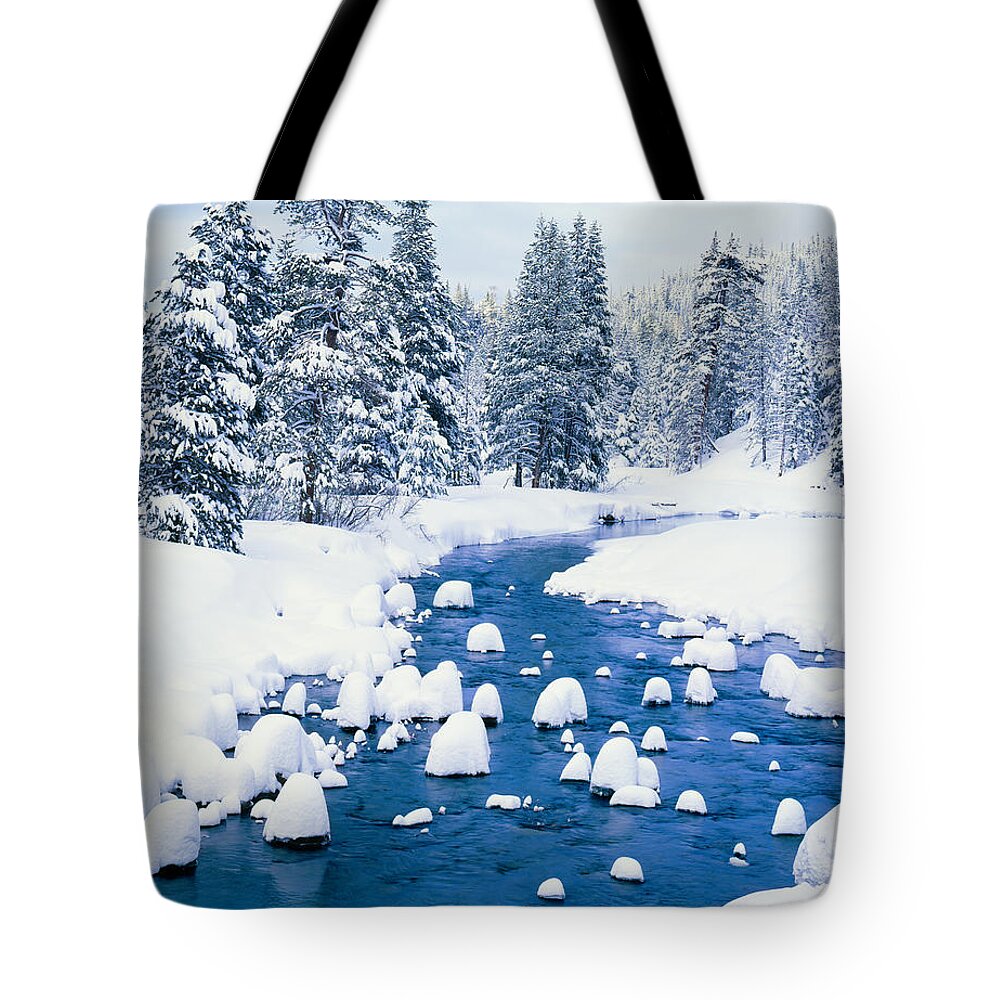 Scenics Tote Bag featuring the photograph Fresh Winter Snow Covers Forest With by Ron thomas