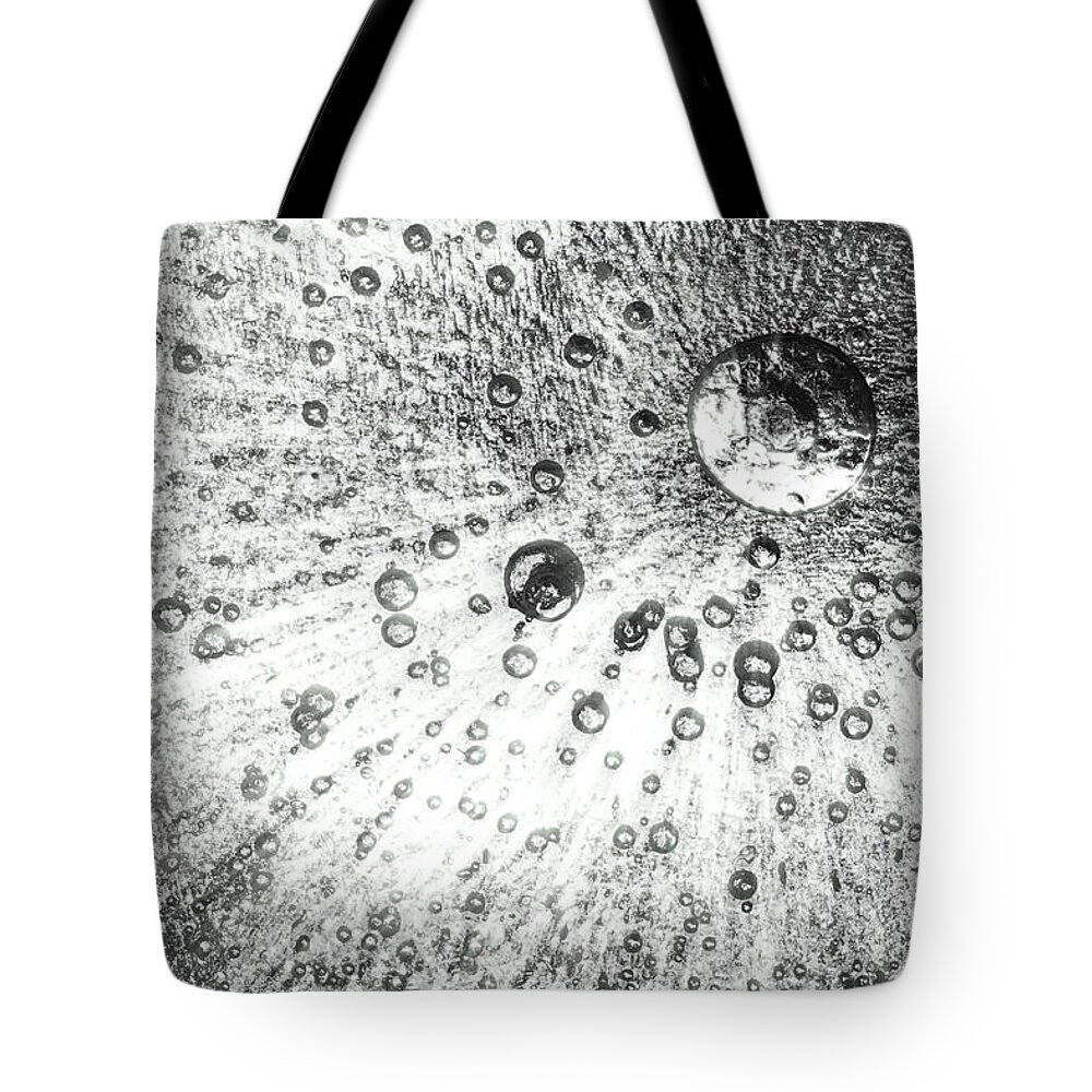 Ice Tote Bag featuring the photograph Frozen ice background black and white by Simon Bratt