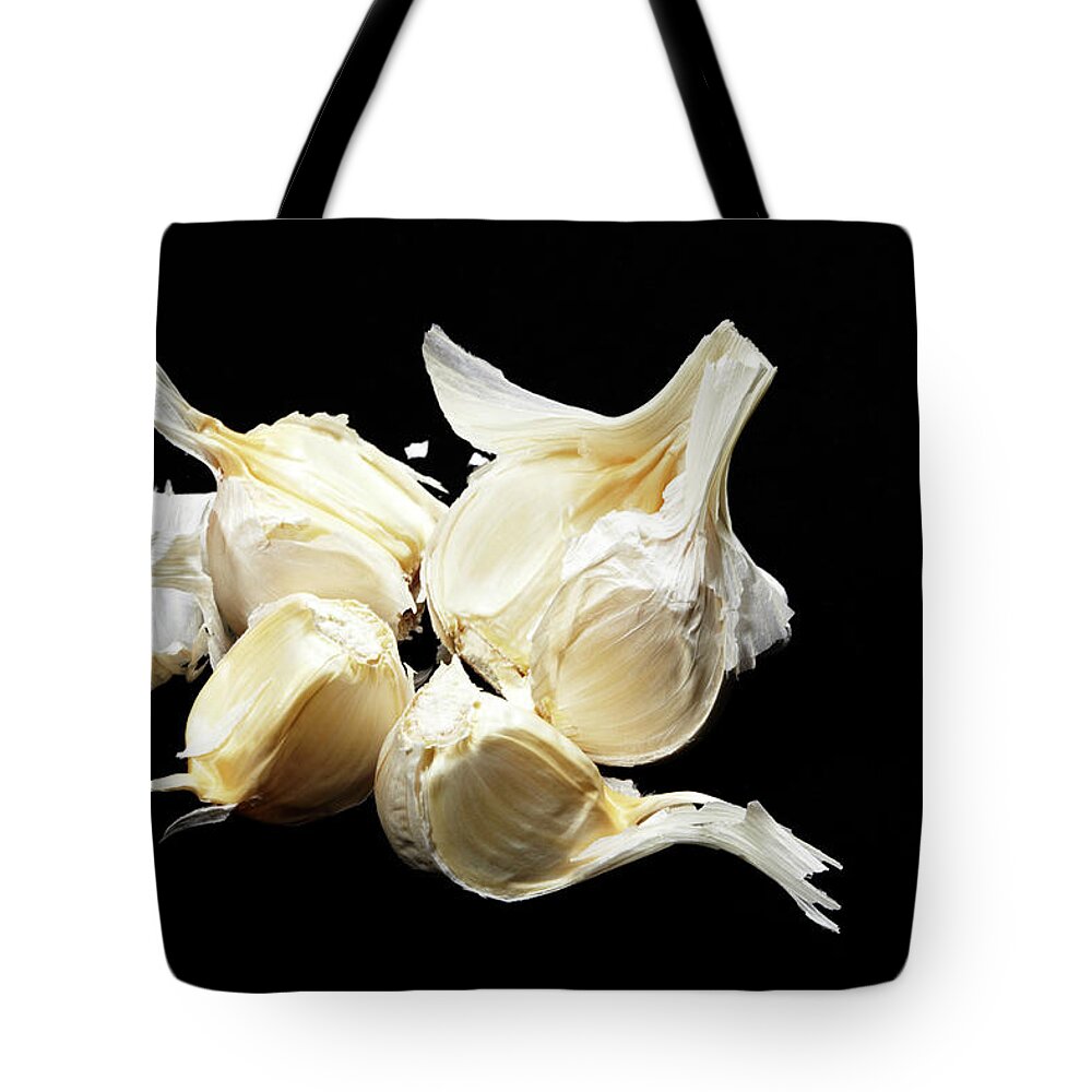 Black Background Tote Bag featuring the photograph Garlic by Yuji Kotani