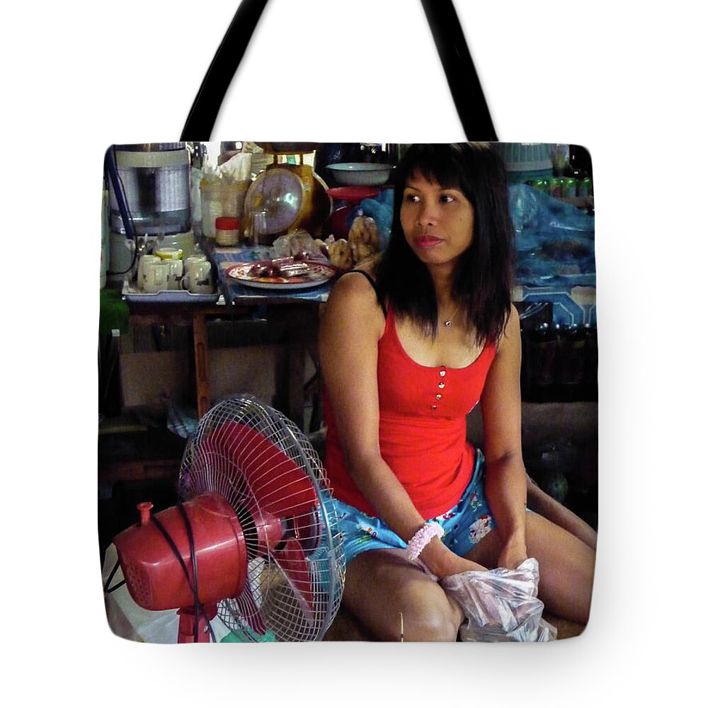 Girl Tote Bag featuring the photograph Girl in a shop by Jeremy Holton