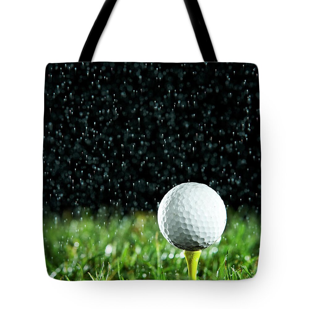 Golf Ball On Tee In Rain Tote Bag by Thomas Northcut 