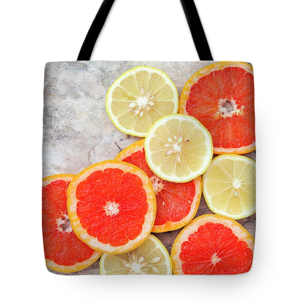Rosario Tote Bag featuring the photograph Grapefruit And Lemon by Flavia Morlachetti
