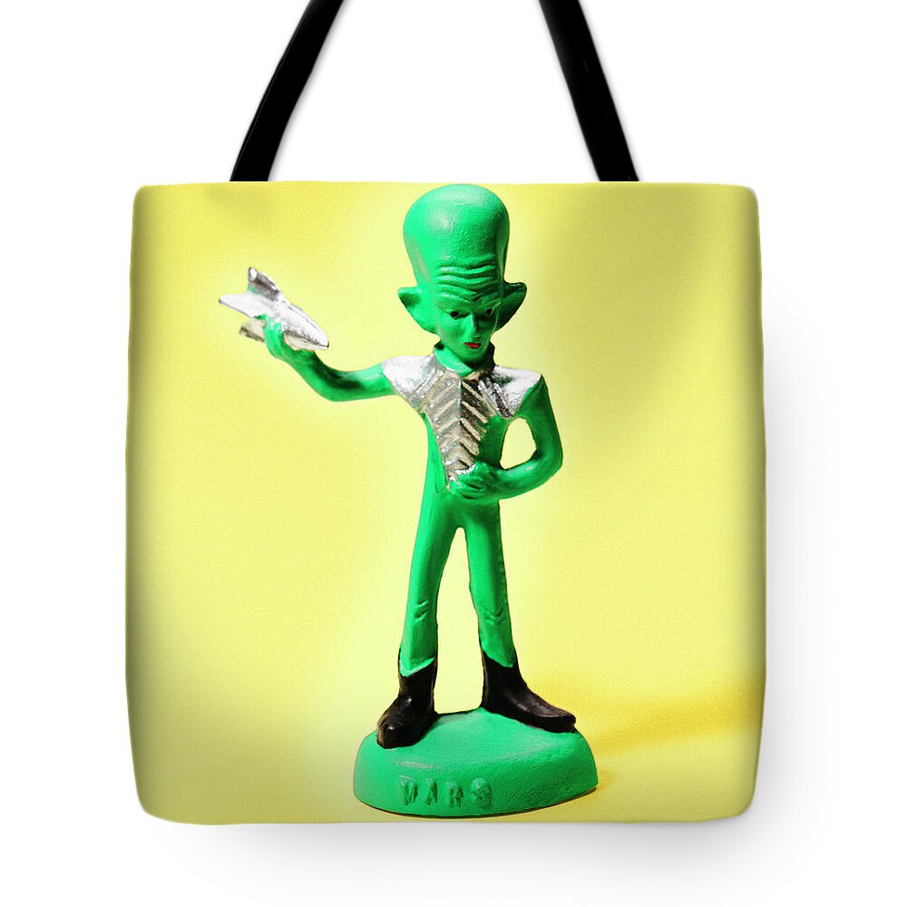 Alien Tote Bag featuring the drawing Green Alien Holding Small Spaceship by CSA Images