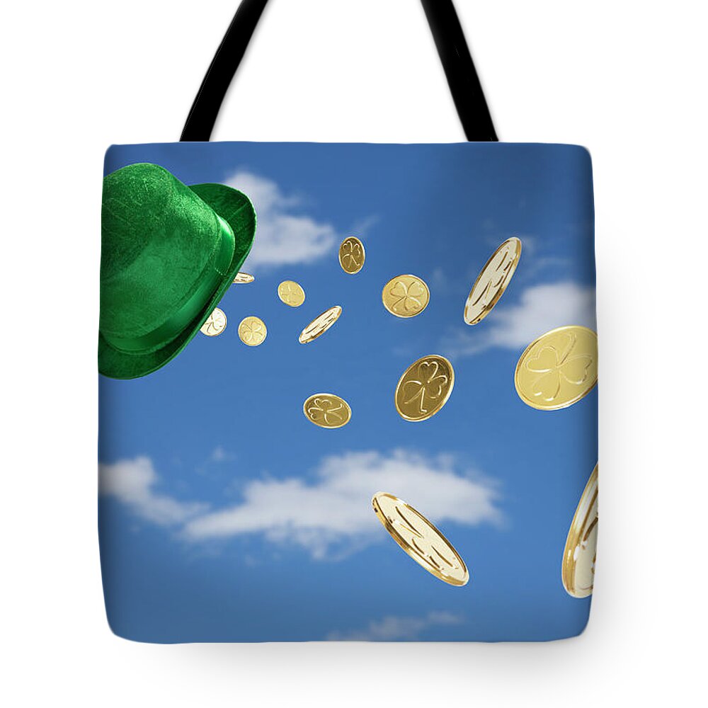 Coin Tote Bag featuring the photograph Green Hat Sweeping Gold Coins by Vstock Llc