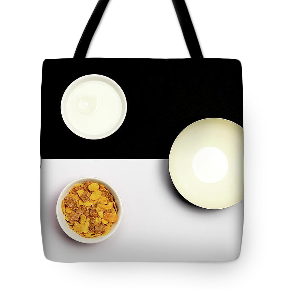 Breakfast Tote Bag featuring the photograph Group ceramic bowls with healthy cereal breakfast by Michalakis Ppalis