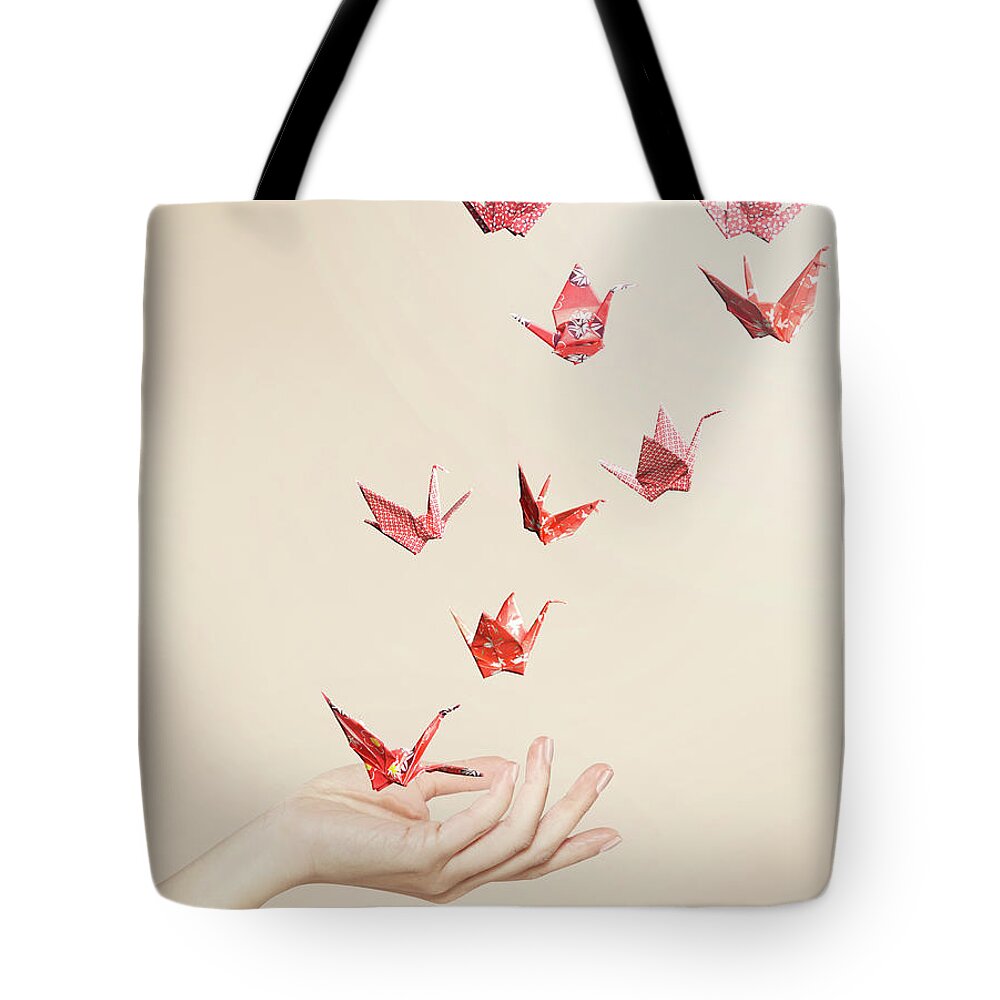 Group Of Red Origami Cranes Flying Away Tote Bag by Paper Boat