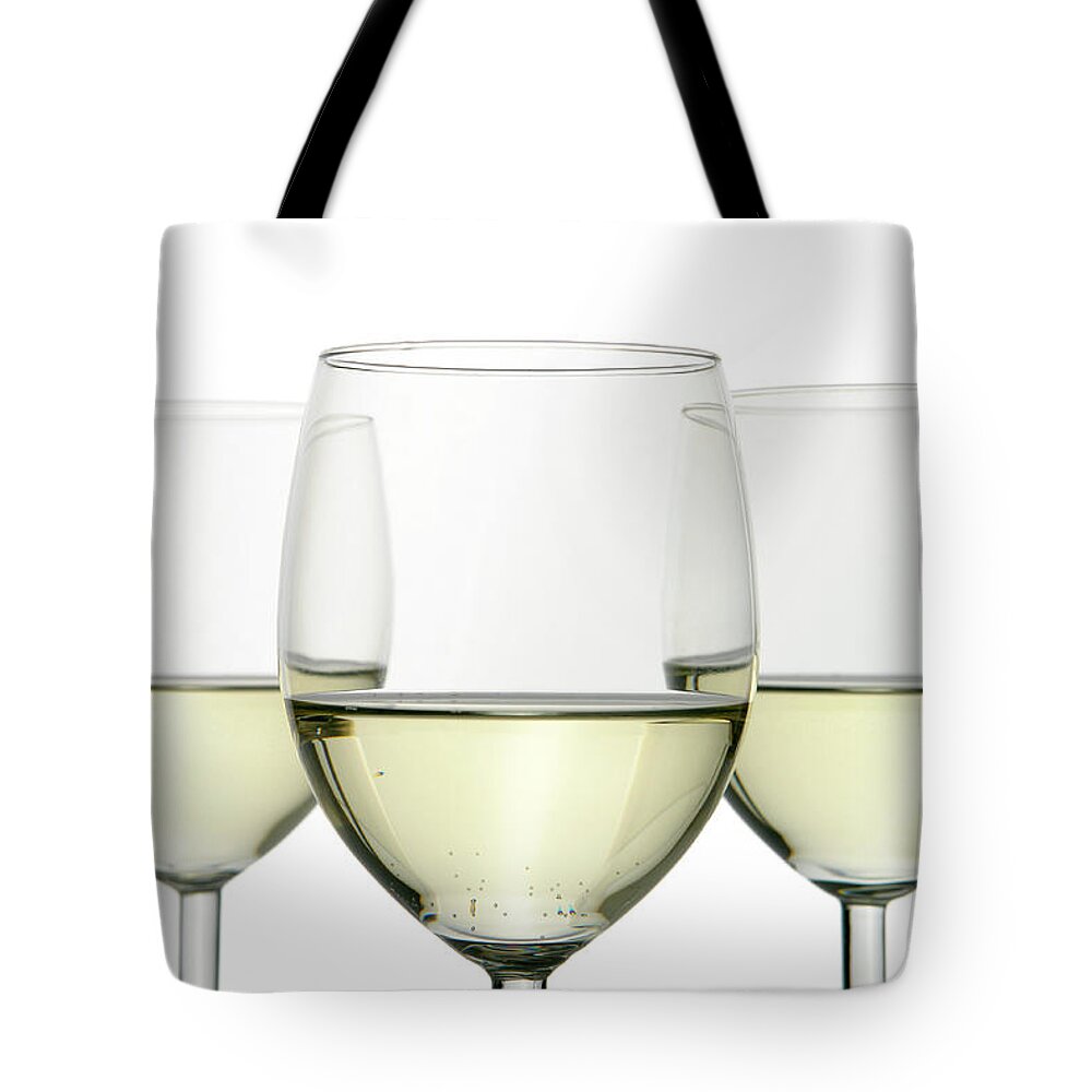 White Background Tote Bag featuring the photograph Group Of Three Wine Glasses Isolated On by Domin domin
