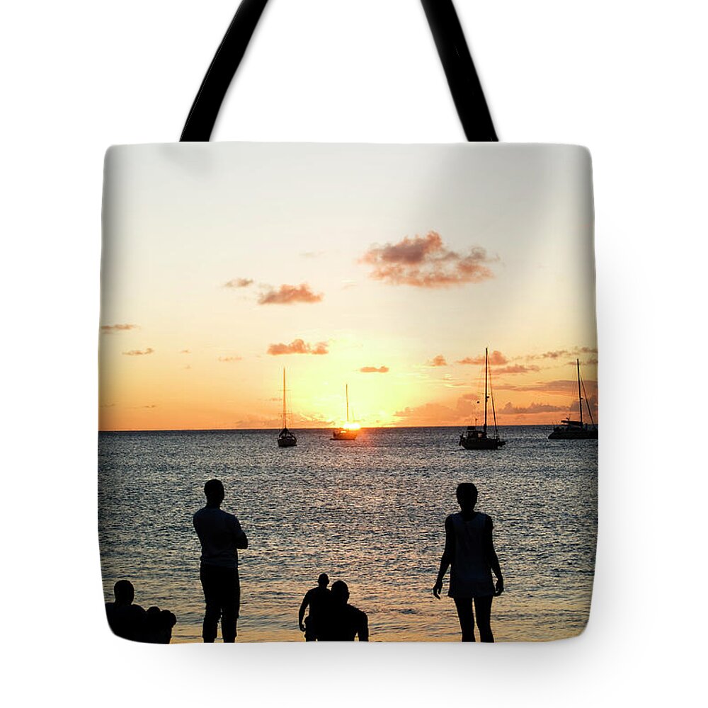 Recreational Pursuit Tote Bag featuring the photograph Group Of Young Friends On Beach At by Jaminwell