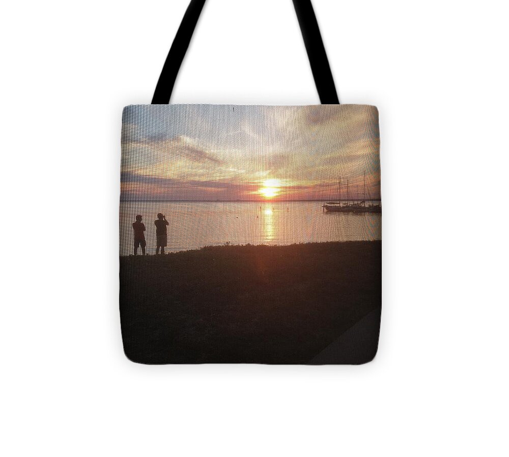 Gulf Breeze Sunset Tote Bag featuring the photograph Gulf Breeze Sunset by Debra Grace Addison