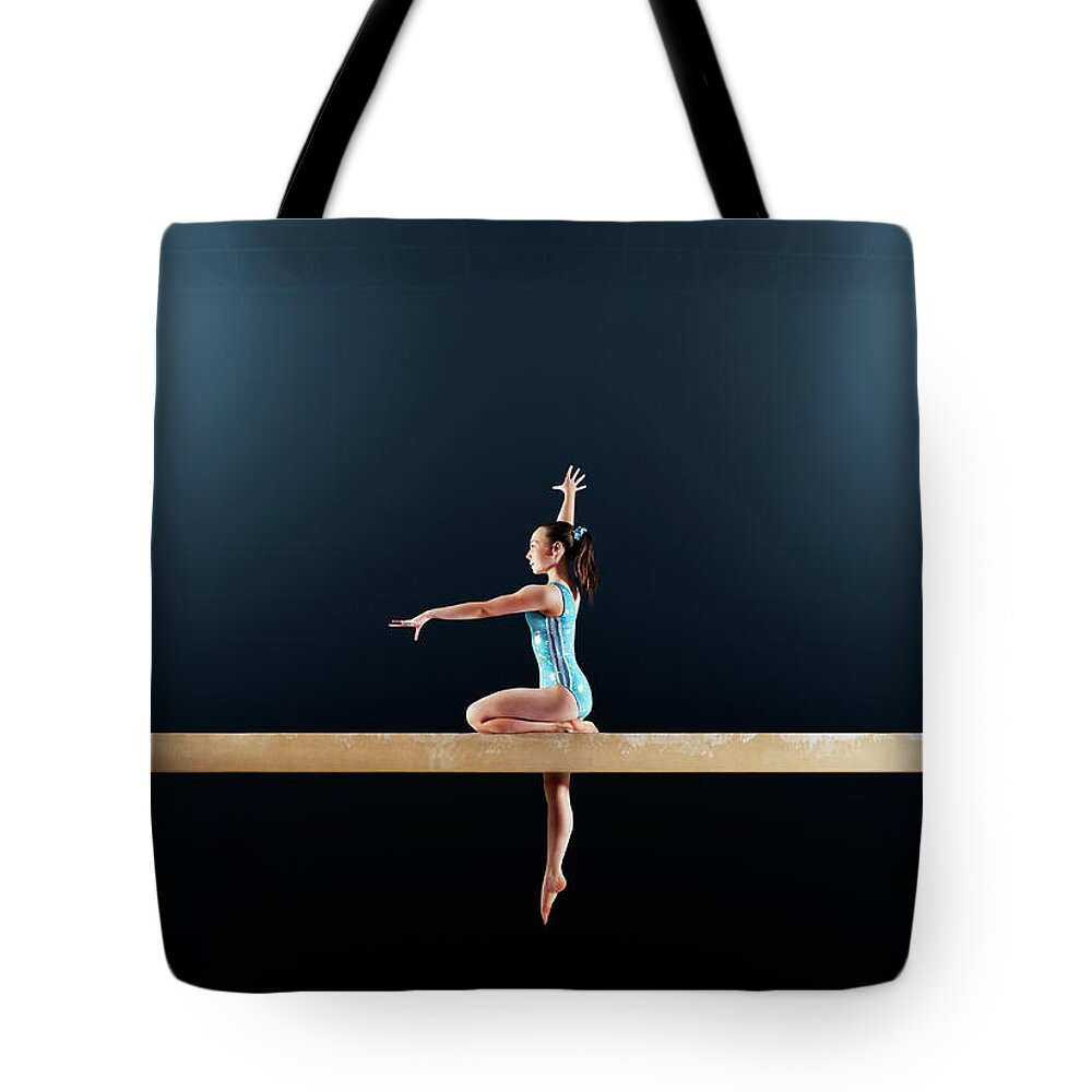 Focus Tote Bag featuring the photograph Gymnast Performing Routine On Balance by Robert Decelis Ltd