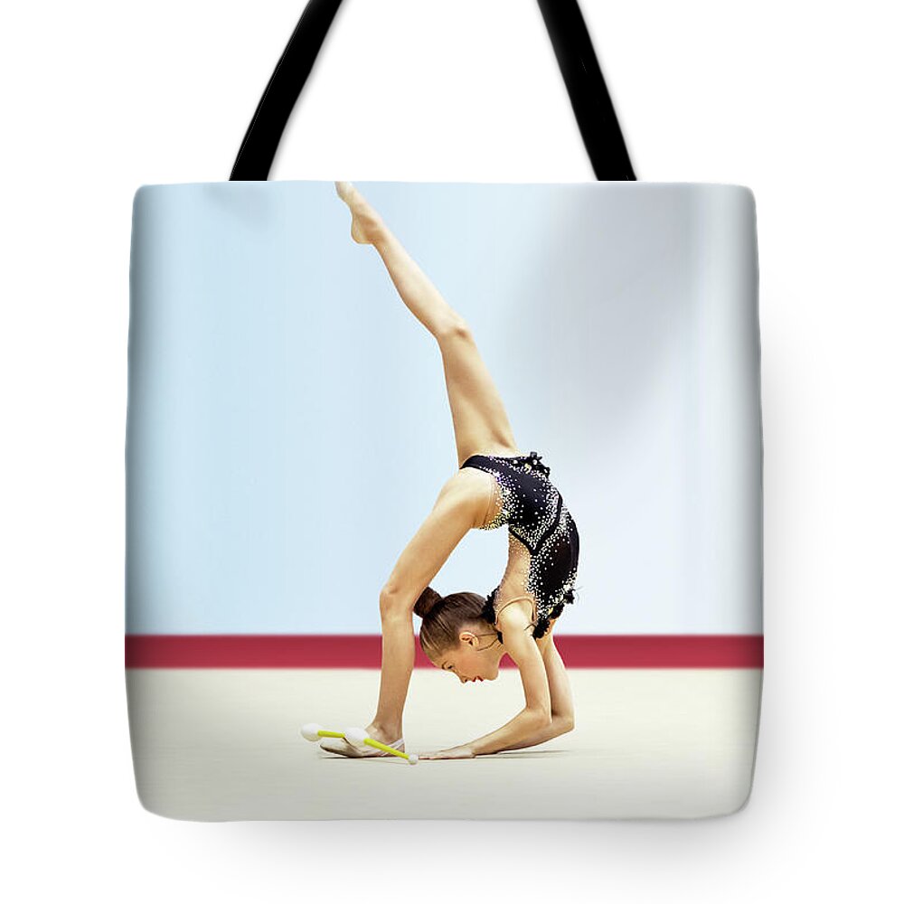 Acrobat Tote Bag featuring the photograph Gymnastic championship by Anna Om