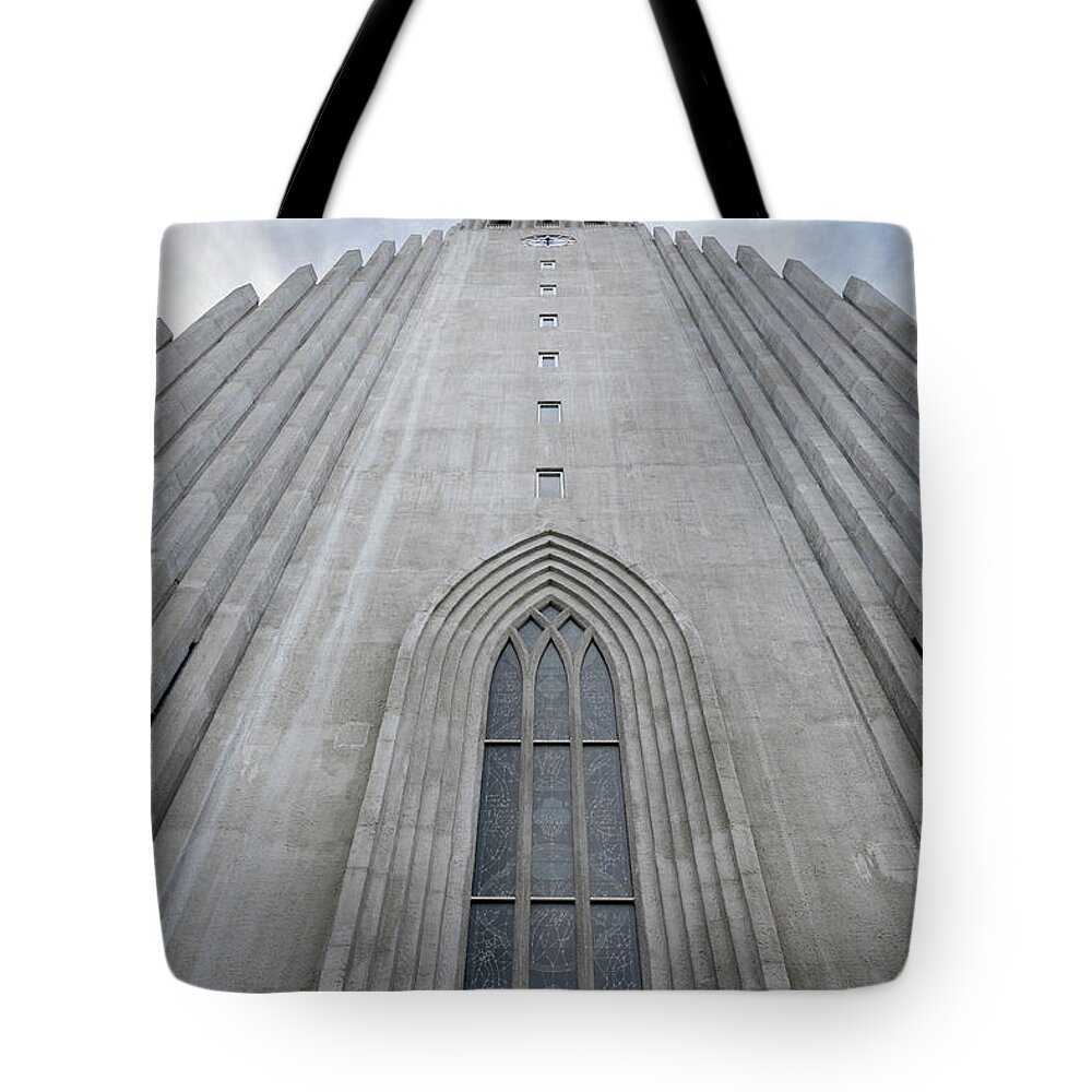Iceland Tote Bag featuring the photograph Hallgrimskirkja facade and bell tower in Reykjavik by RicardMN Photography