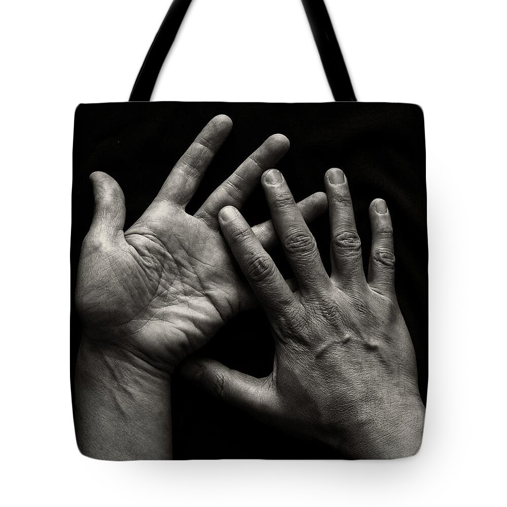 People Tote Bag featuring the photograph Hands On Black Background by Luigi Masella